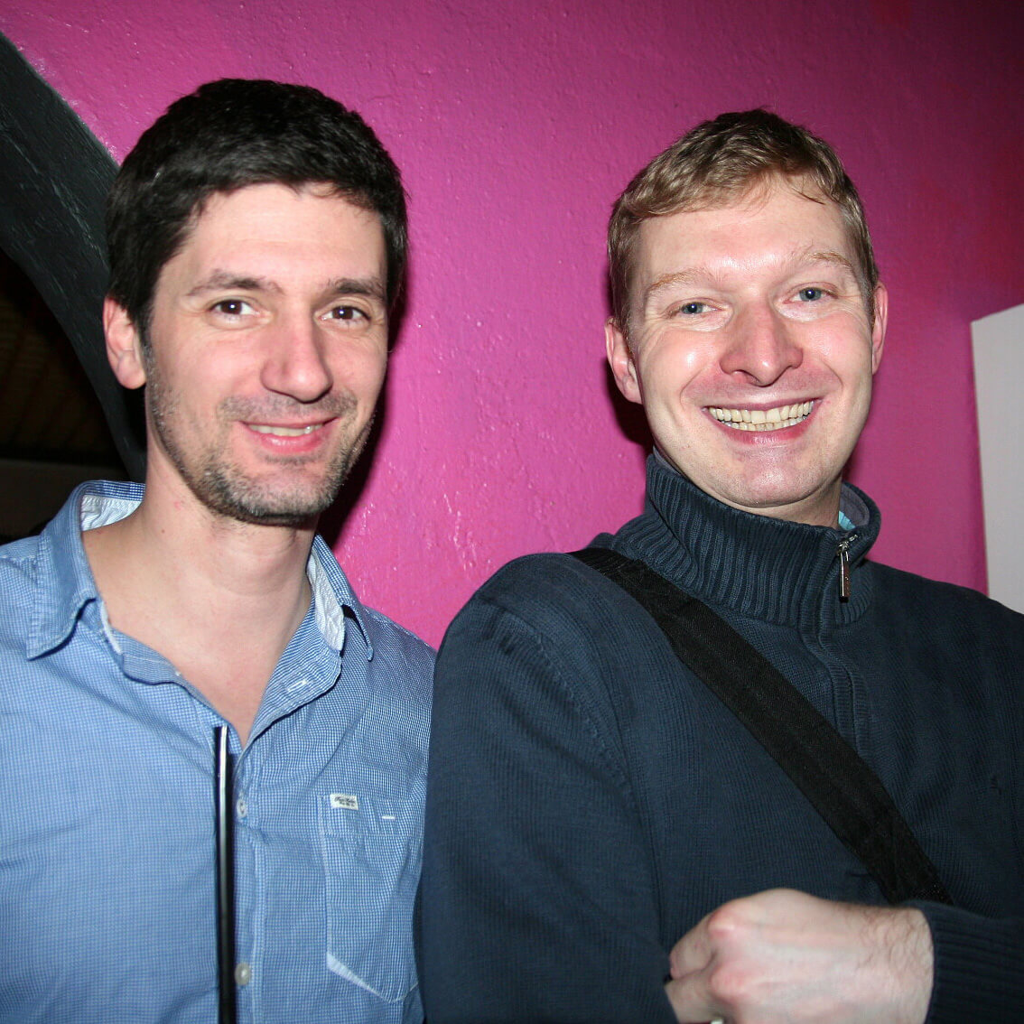 Two Keen employees standing next to each other smiling